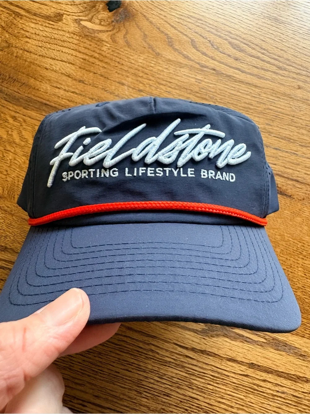 New with tags Fieldstone Navy hat with Red Accent - mens- SnapBack